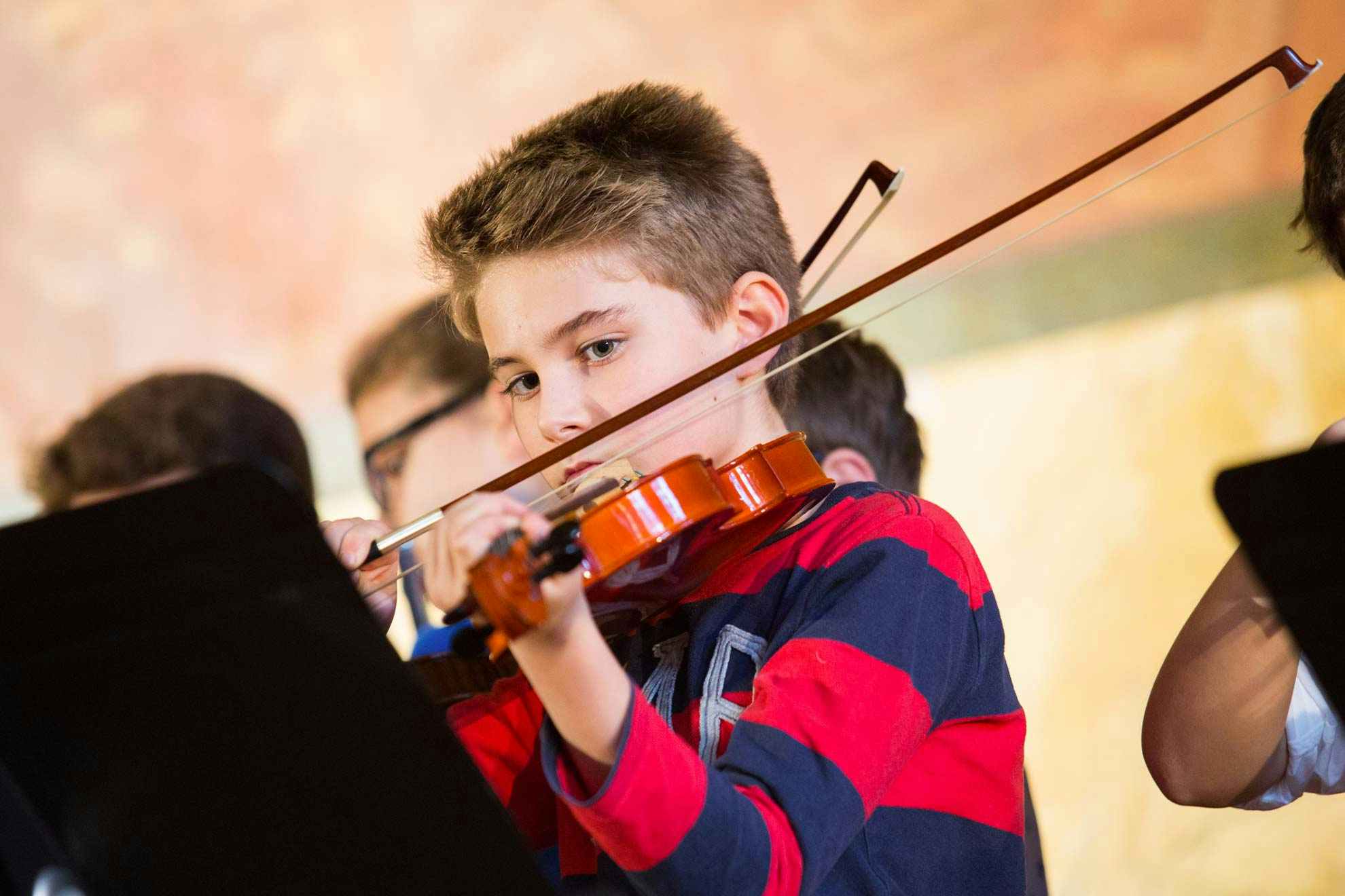 Young teenager plays violin